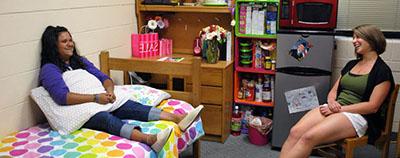 Students relaxing in dorm room (small)